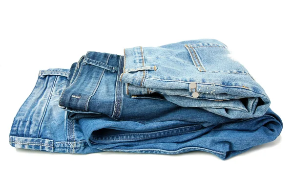 Несколько синие джинсы мода, изолированные на белом — стоковое фото
