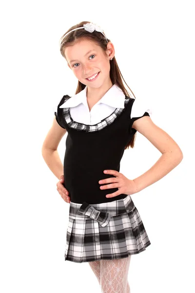Красивая девочка в школе единообразных изолирован на белом — стоковое фото