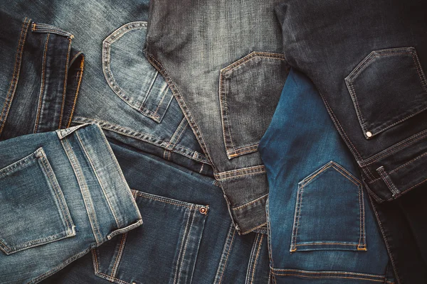 Фон разные джинсы мода. Ретро тонированный — стоковое фото
