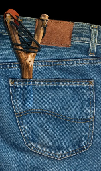 Старый рогатка в джинсовый карман — стокC